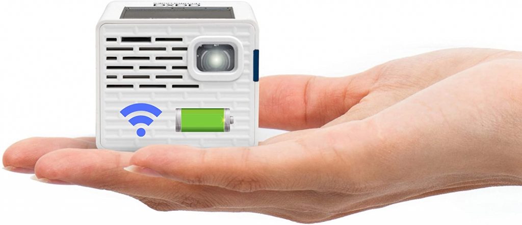 a mini projector sits in the palm of someone's hand