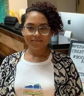 A picture of Jennifer standing in a tshirt and jacket