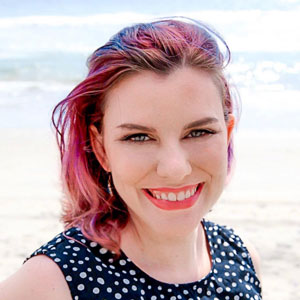 A picture of Meggan standing on the beach