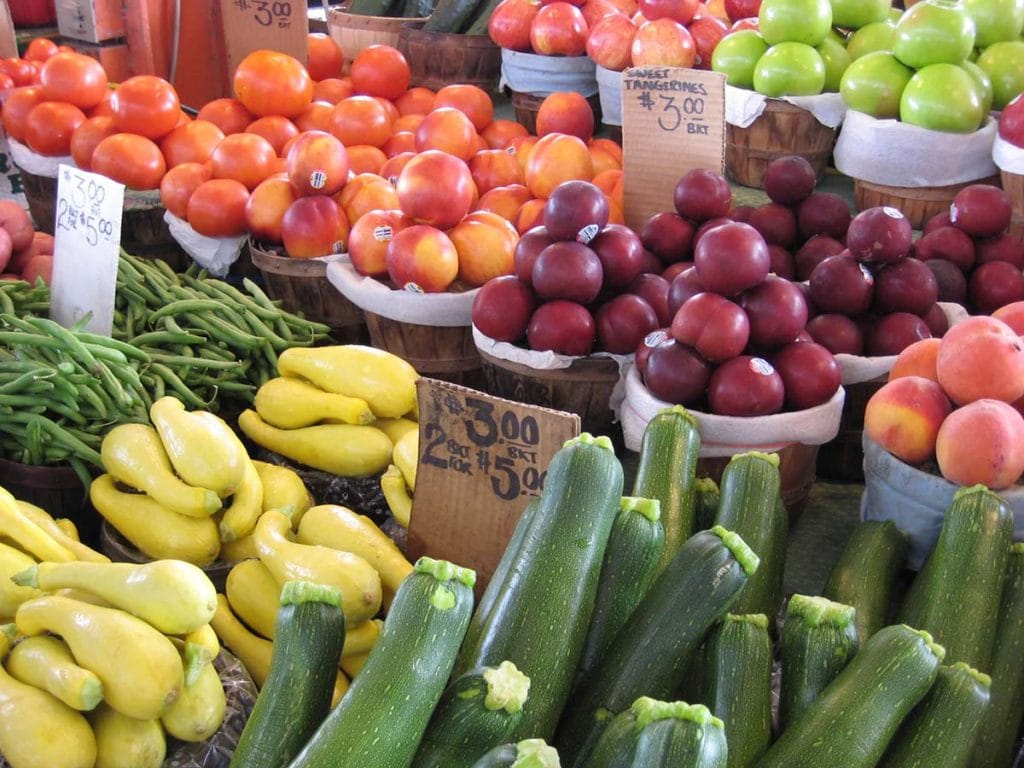 Baskets of colorful fruits and veggies at the Dallas Farmers Market