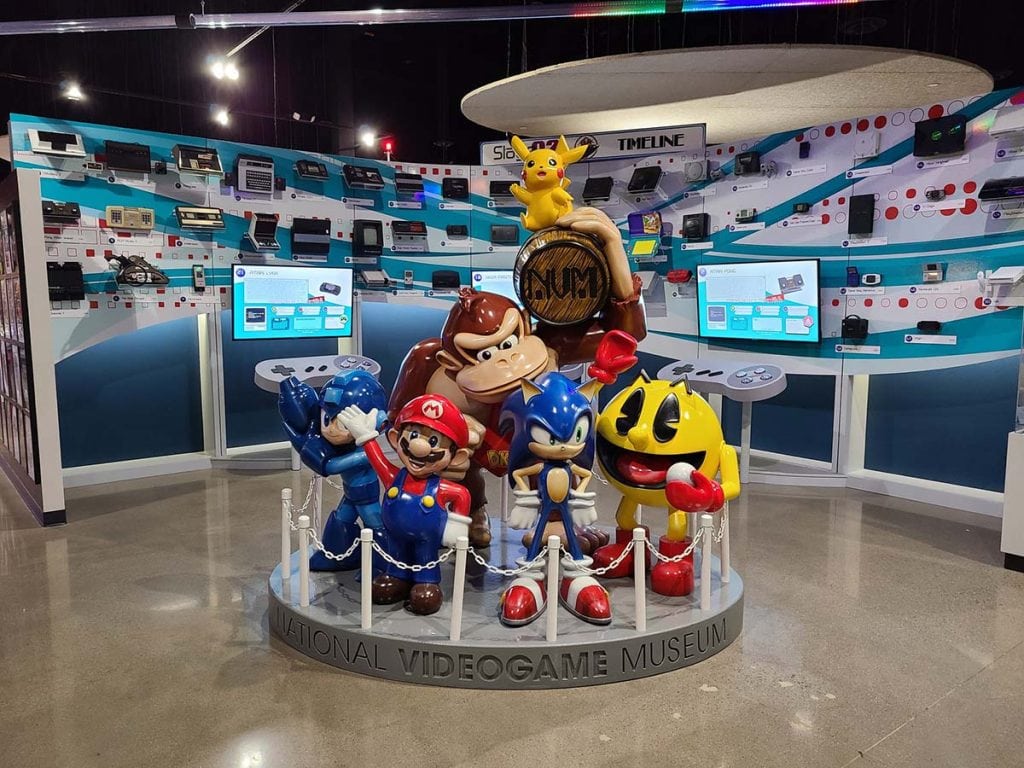 Mario, Pac-man, Donkey Kong and more stand as sculptures in the middle of the national video game museum