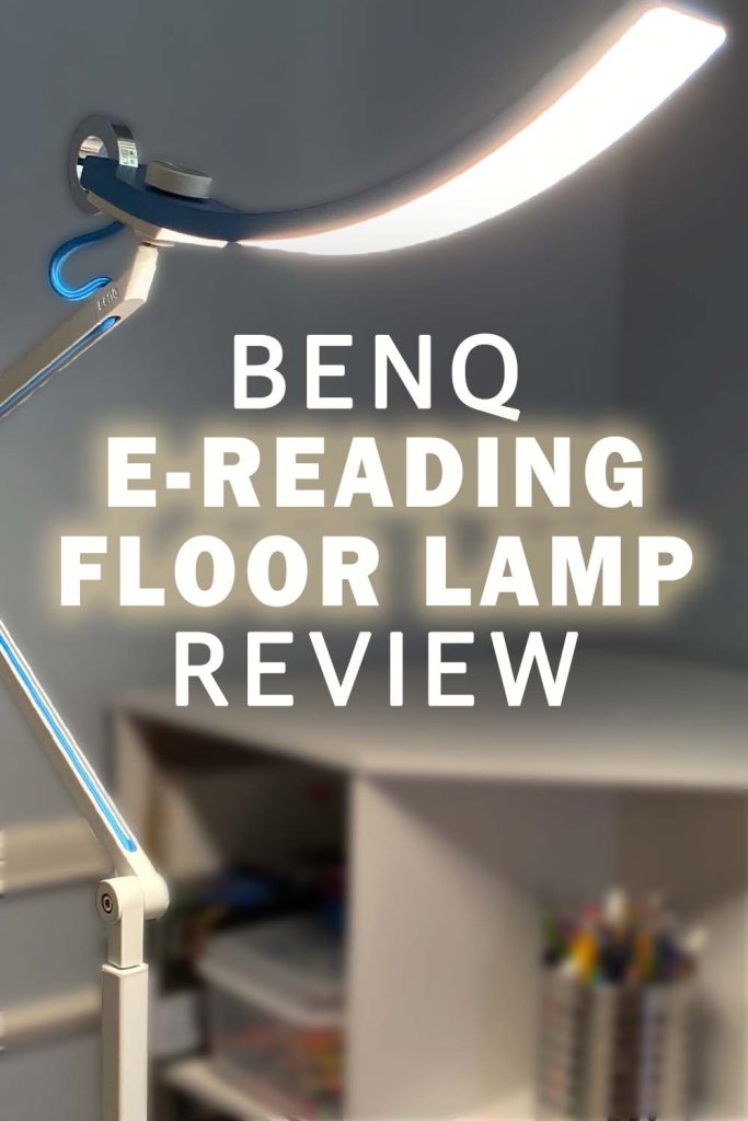 A benq e-reading floor lamp stands next to a corner bookshelf. The lamp is blue and the bookshelf is white. Text reads "benq e-reading floor lamp review"